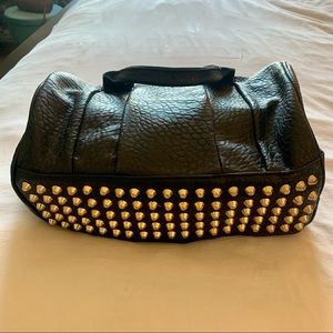 Black gold-studded handbag
